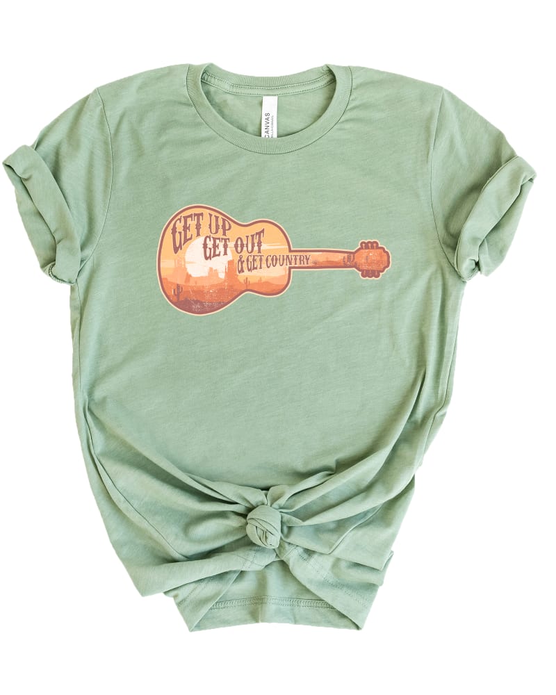 Front of a model wearing a size XL Get Up Get Out Get Country Short Sleeve Graphic Tee in Sage by Simply Sage Market. | dia_product_style_image_id:301162